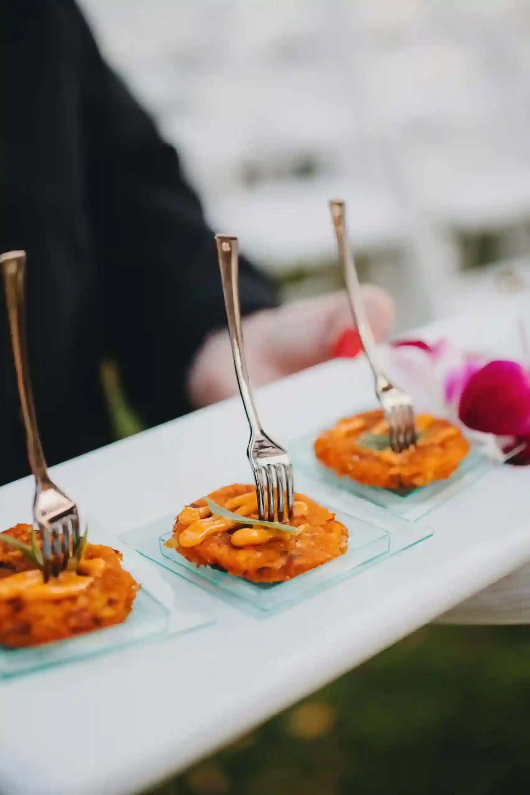 Appetizers with forks on serving tray