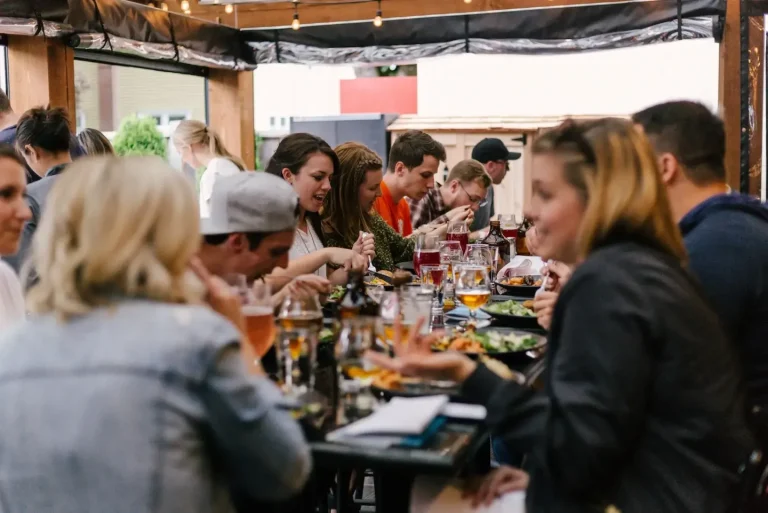 Group dining at outdoor restaurant.