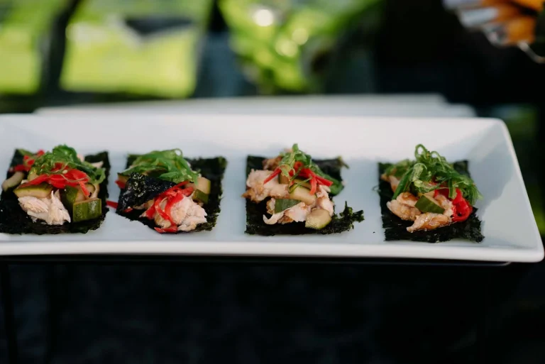 Plate with sushi bites on seaweed.